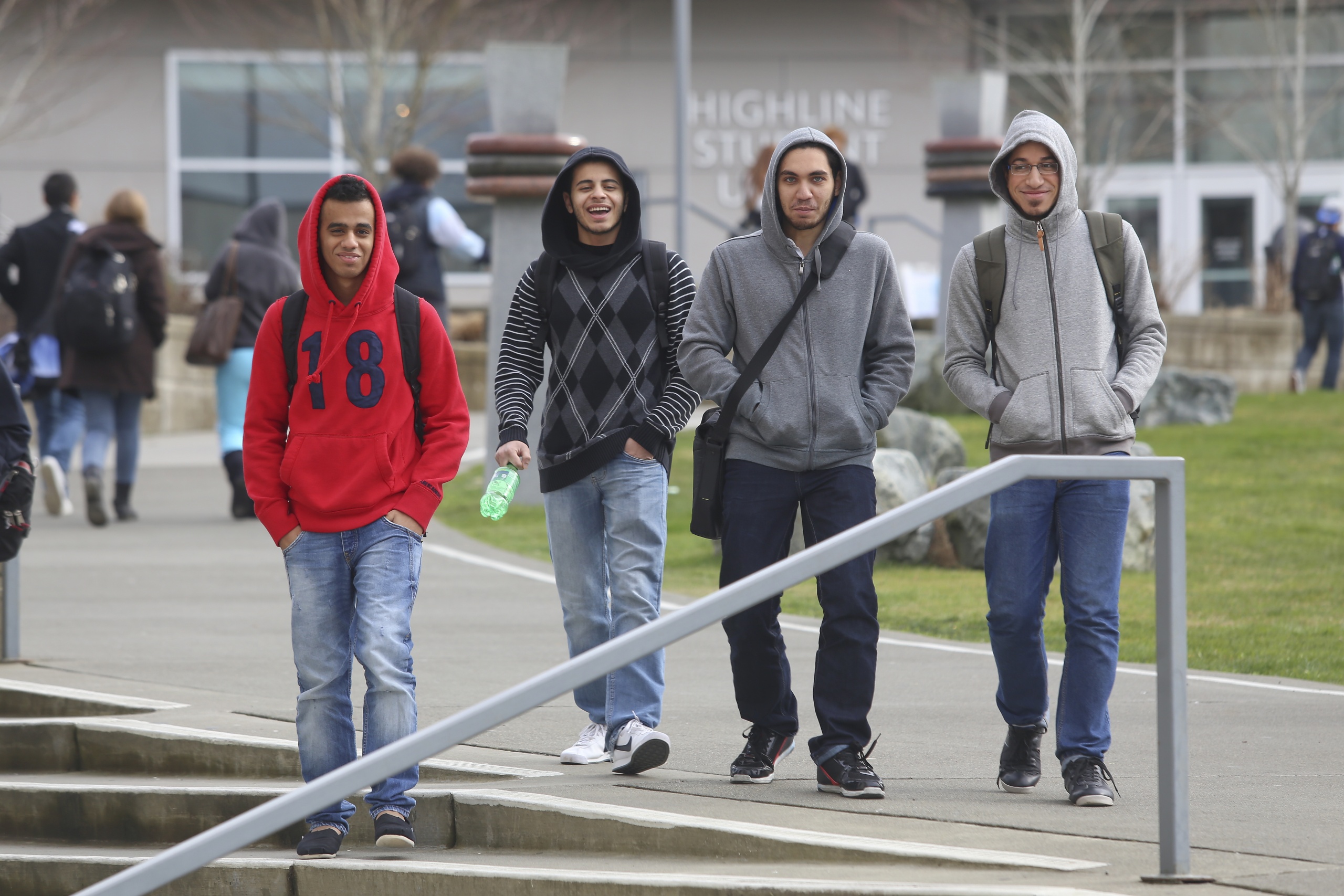 Four students walking on campus